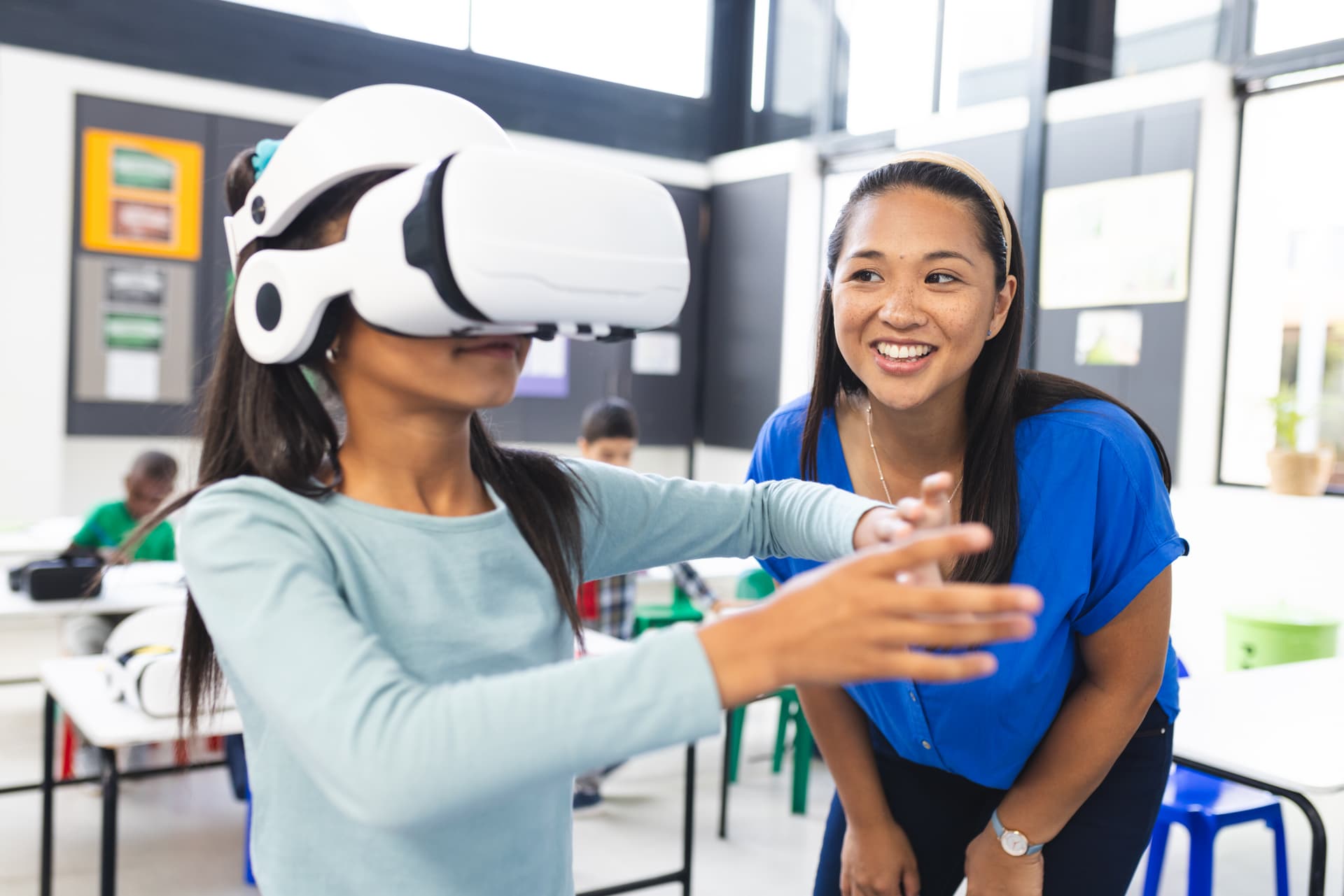 Teacher guiding student with VR